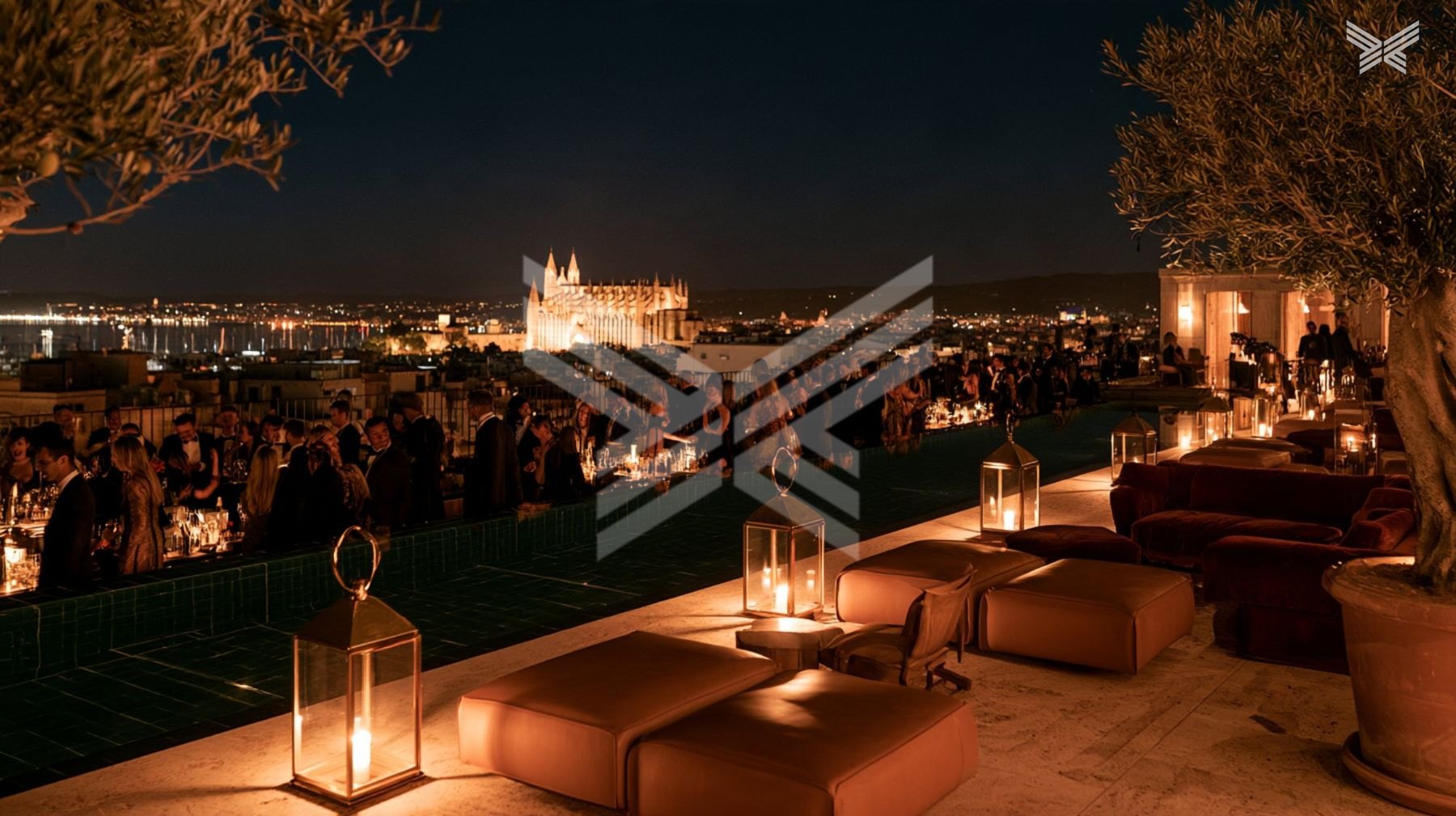 Rooftop terrace of a club hotel above the Bay of Palma at night
