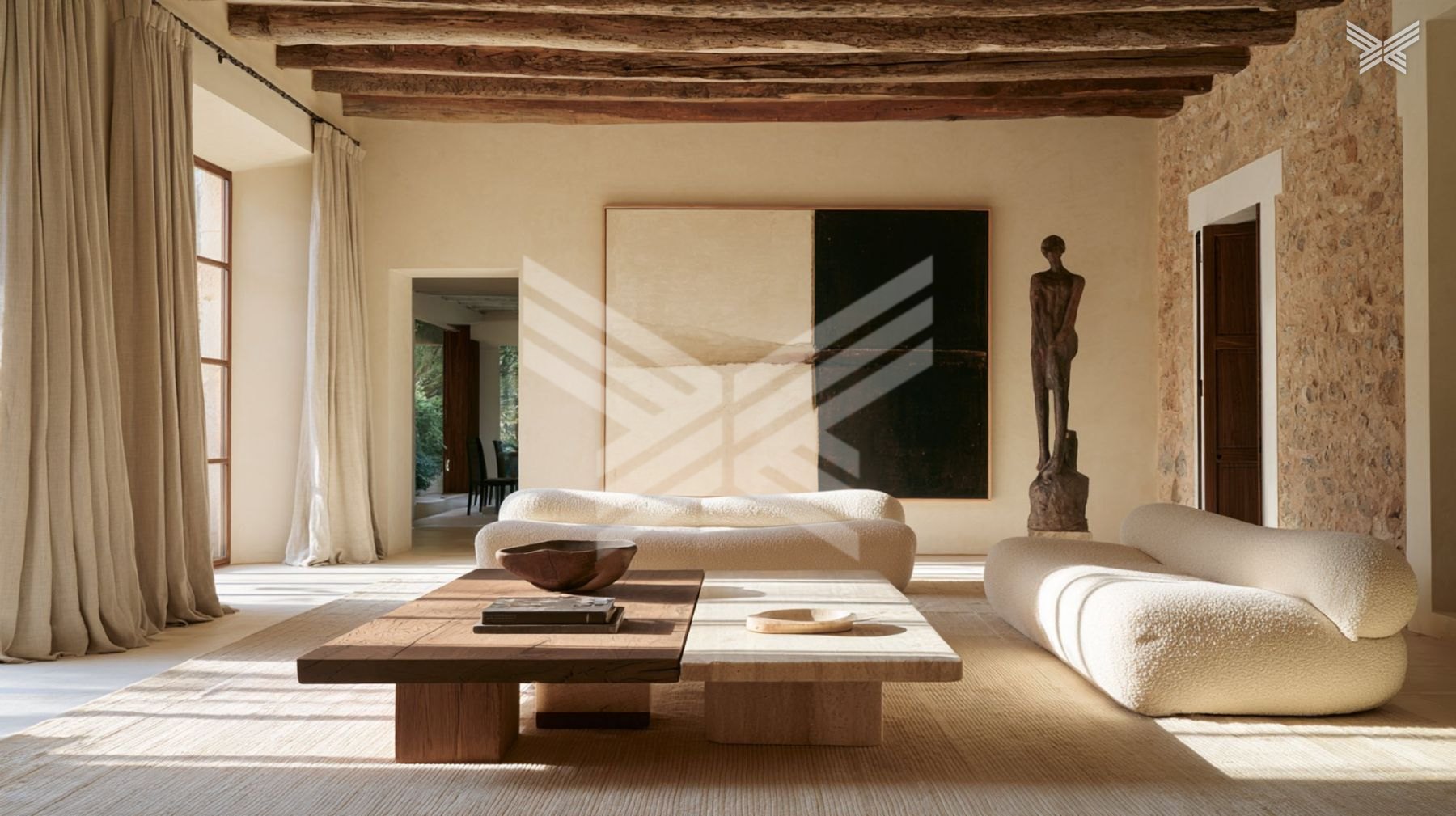 Great room of a stone finca with old beams and cream sofas